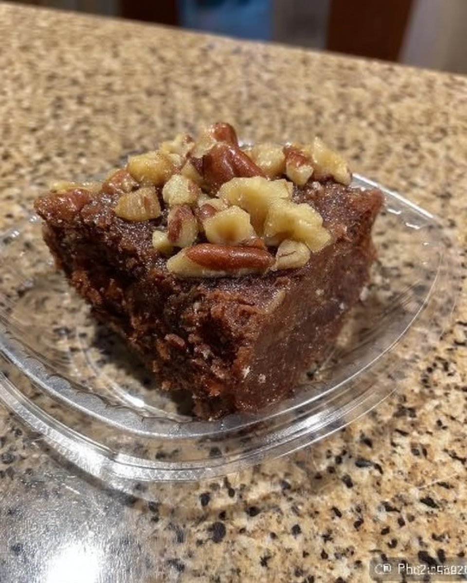 Ingredients for chocolate cake including cocoa powder butter and pecans