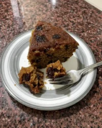Classic Southern fruitcake loaf on a holiday table with tea