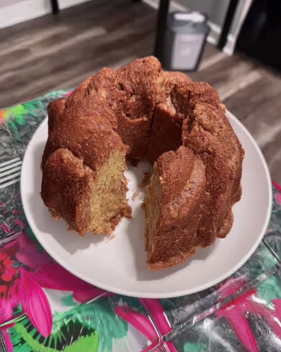 Slice of classic vanilla yellow cake on a rustic plate