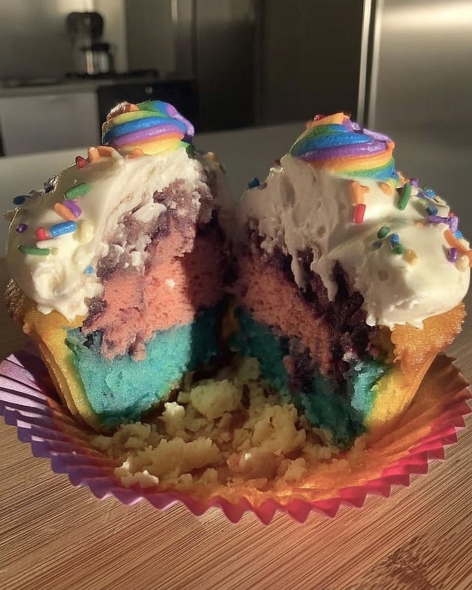 Four bowls of colorful cake batter red blue green yellow