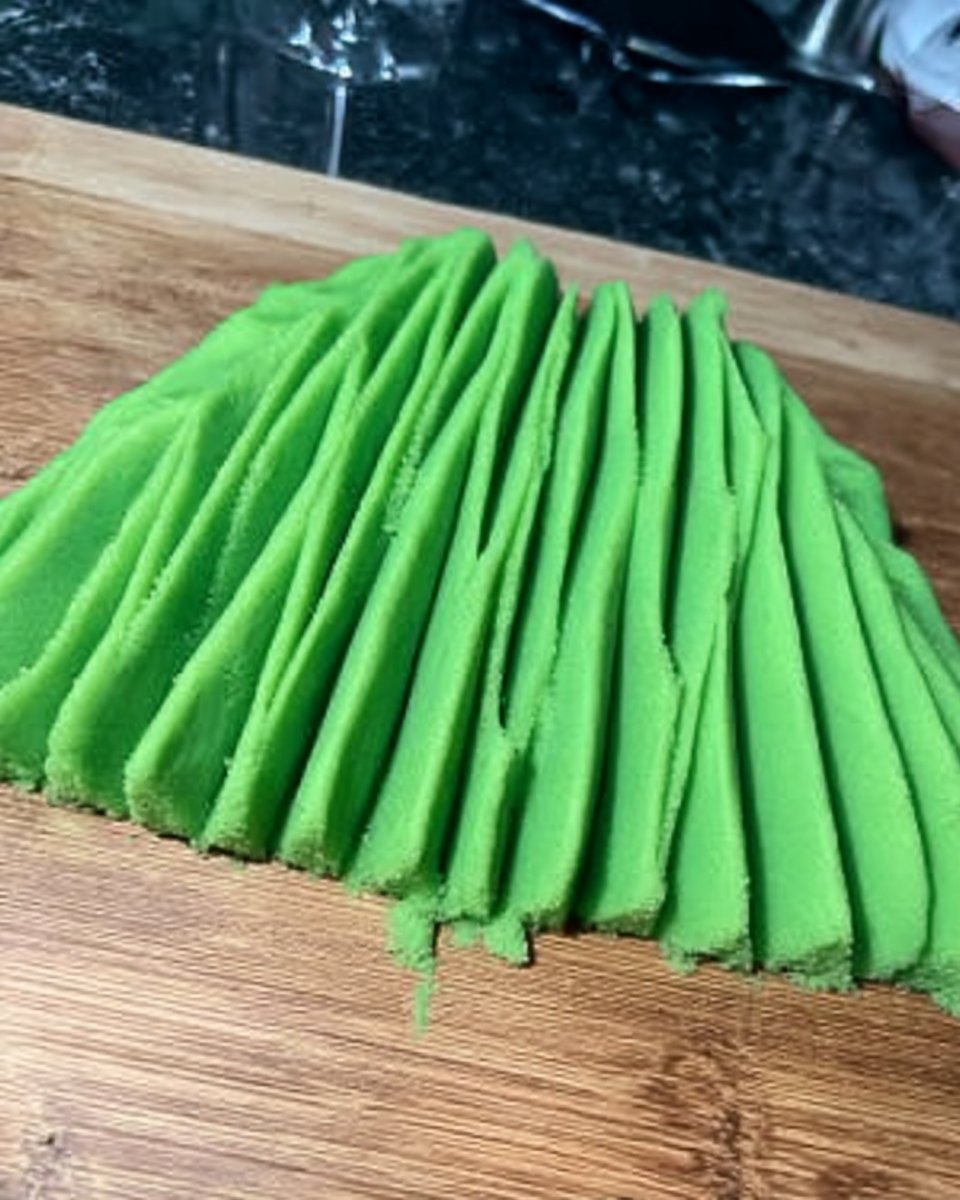 Jungle Theme Cake 13 spatula folding cocoa flour into egg foam ribbon stage