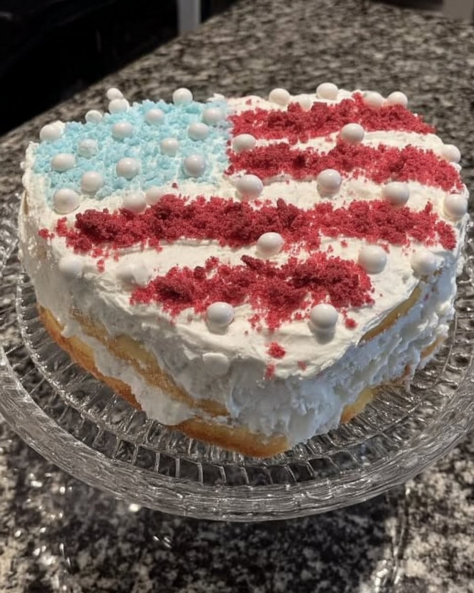 Red White and Blue Cake 12 Fresh strawberries blueberries yellow cake mix and whipped topping on a wooden board