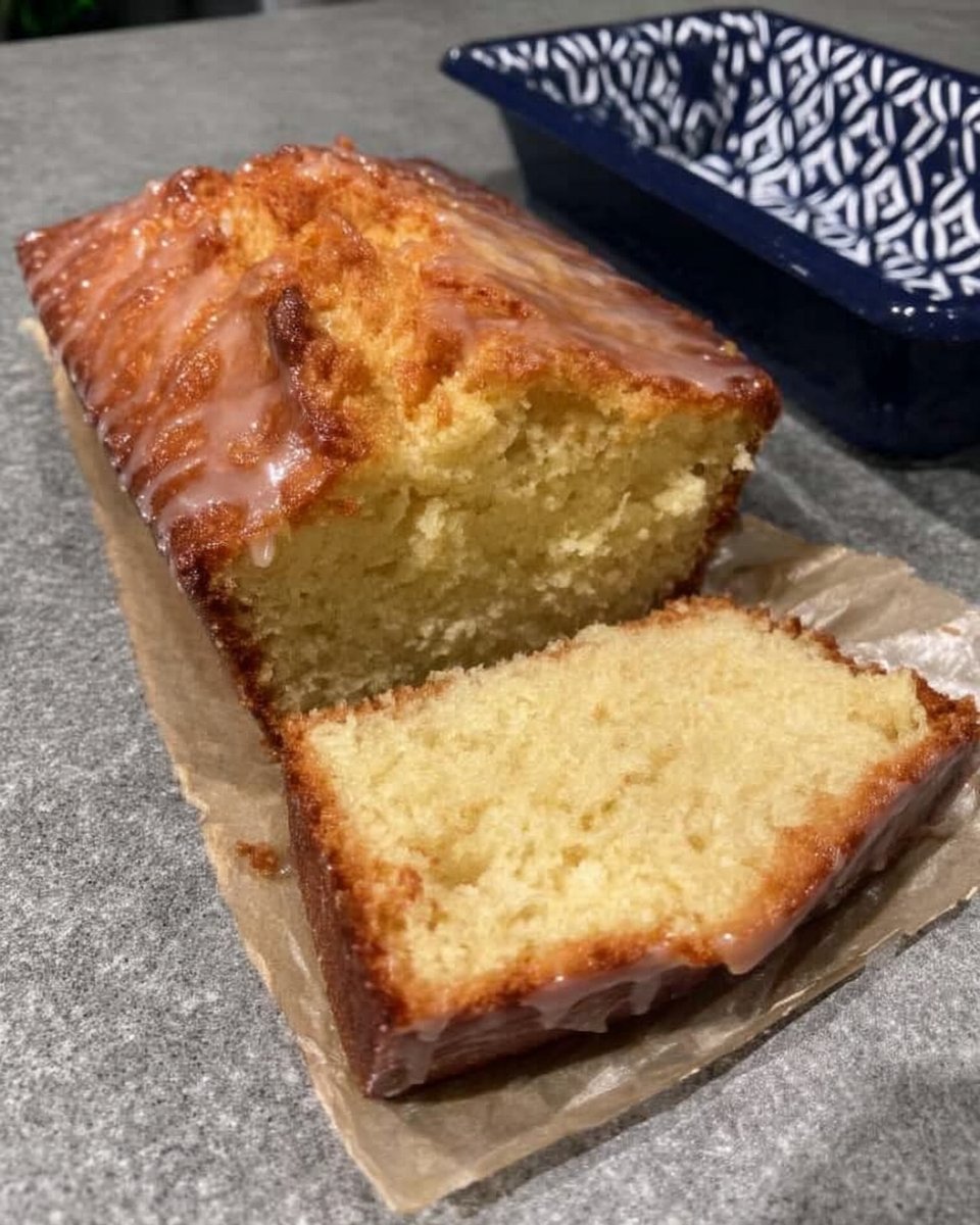 Lemon Drizzle Cake 12 Bowl of white sugar being mixed with fresh yellow lemon zest