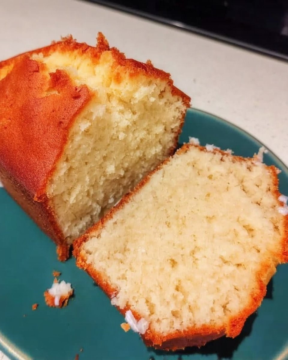 Butter sugar eggs and lemon yogurt on a wooden table
