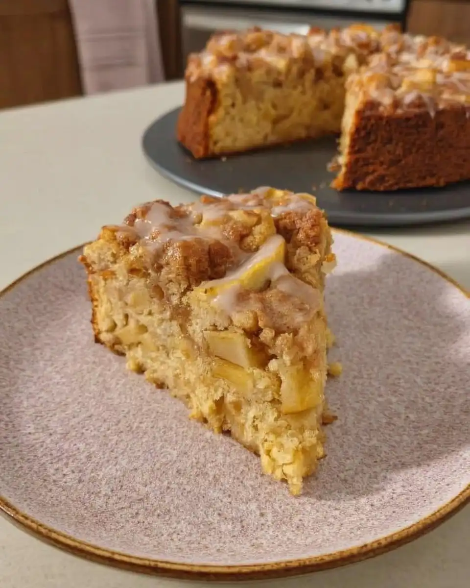 Irish Apple Cake 10 Slice of Irish apple cake showing layers of cake apple and streusel