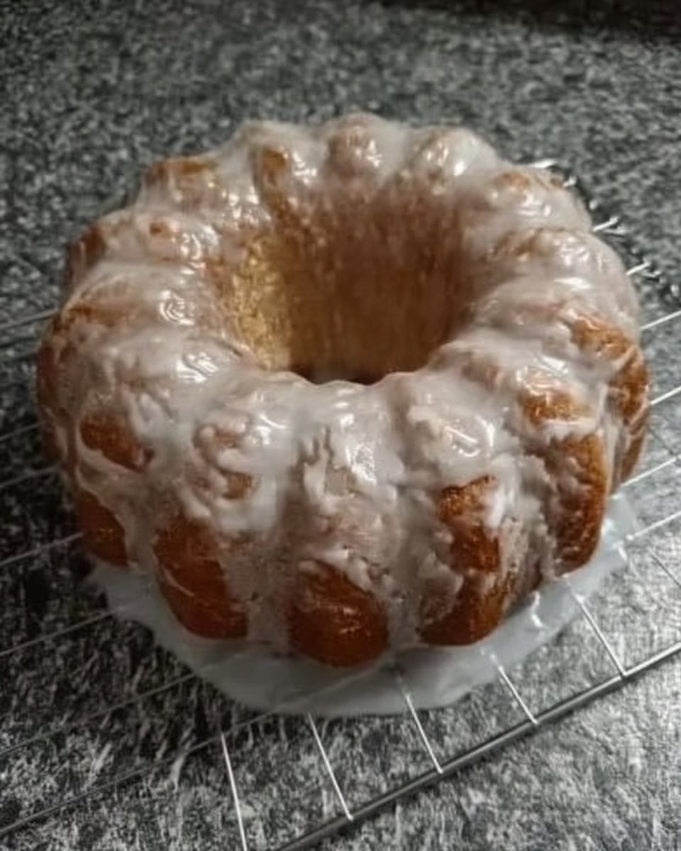 Close up of lemon pound cake texture showing moist crumb and golden crust