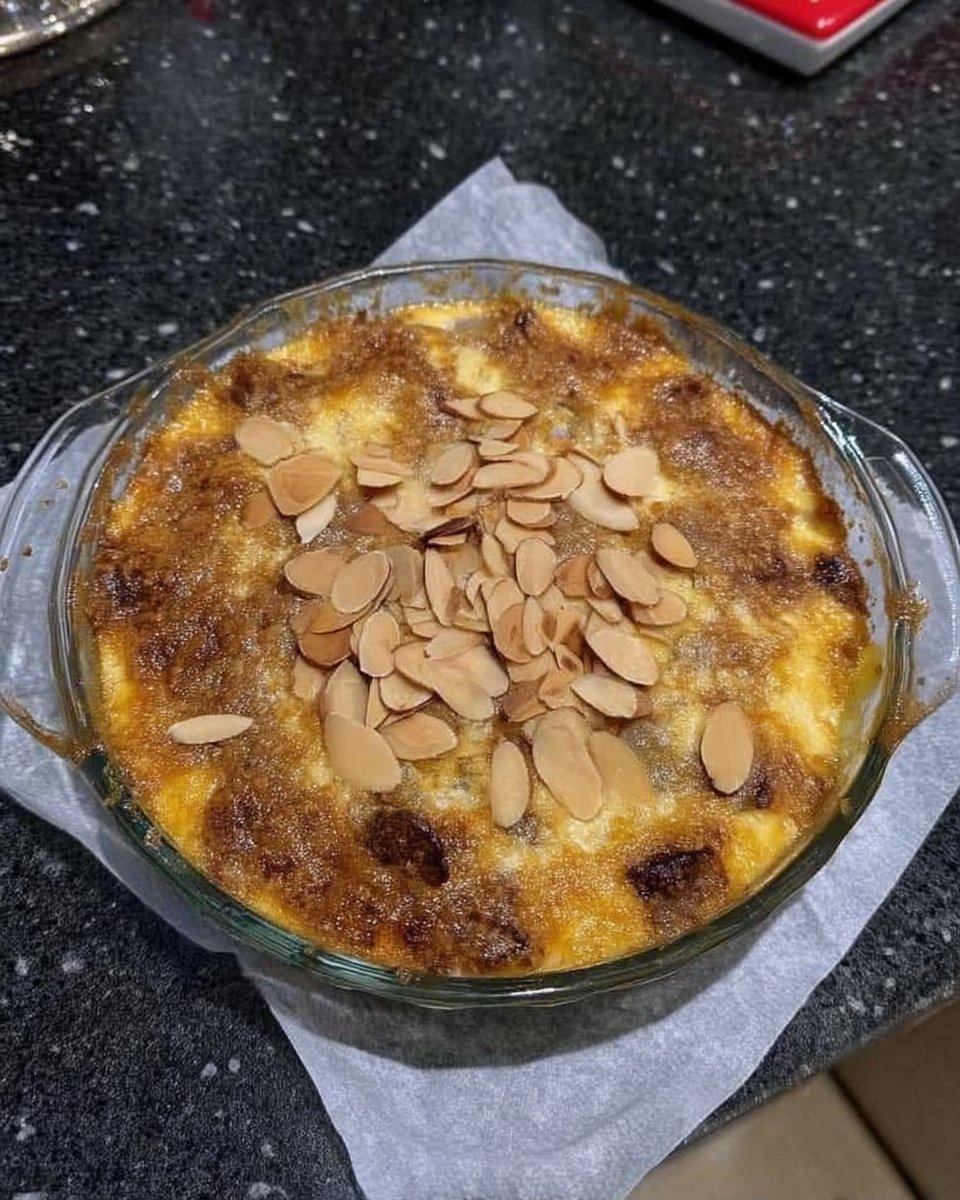 Peach Dump Cake 14 Peach dump cake served in a bowl topped with melting vanilla ice cream