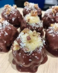 Cake balls cross section showing dense moist interior and thin white chocolate shell