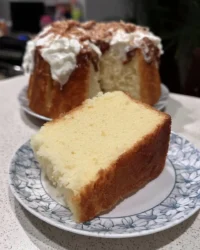 slice of fluffy chiffon cake with berries on a white plate