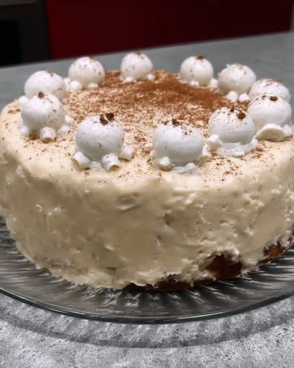 Eggnog Cake 10 Slice of eggnog cake with ermine frosting and pecan coating