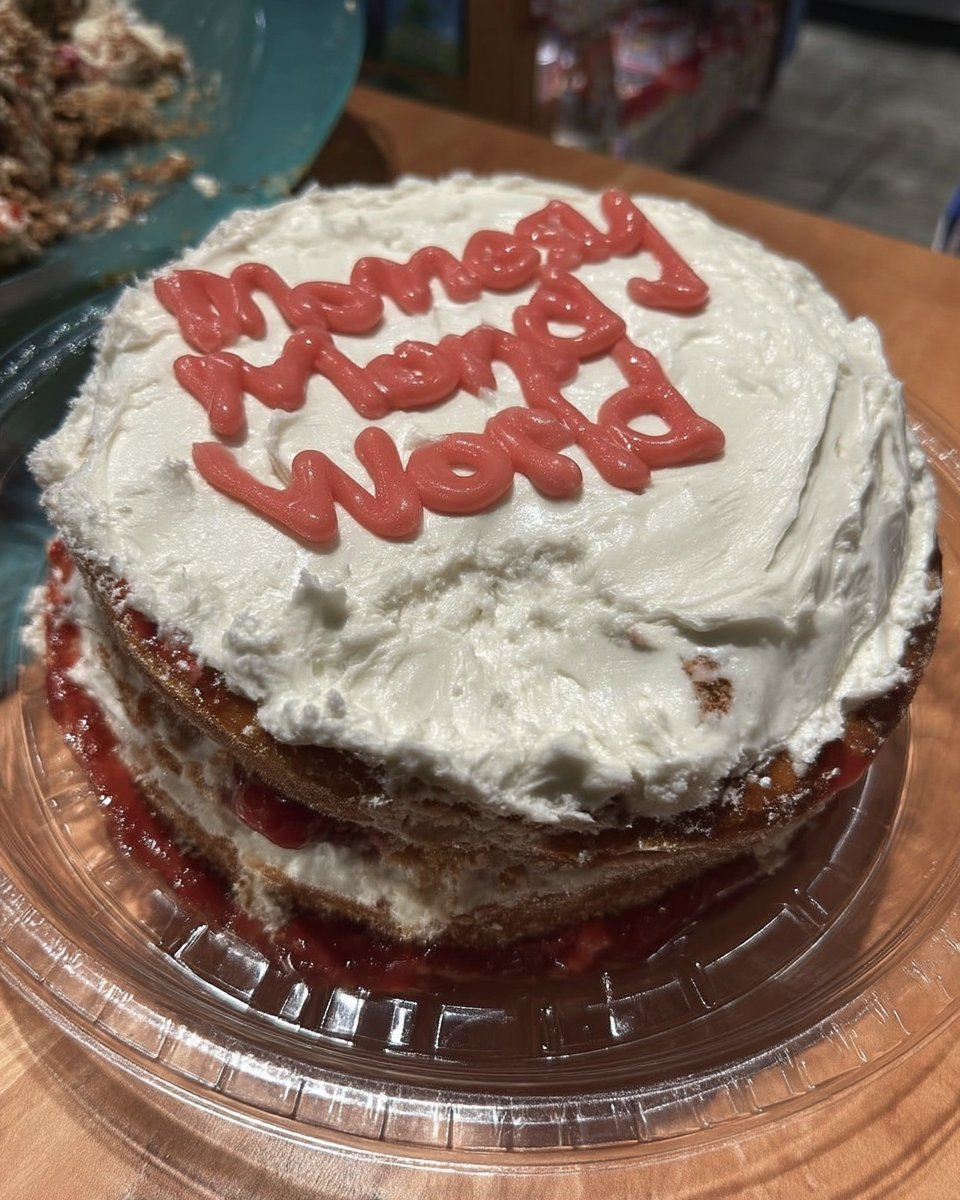 Slice of white Mother's Day cake with chocolate and vanilla buttercream layers
