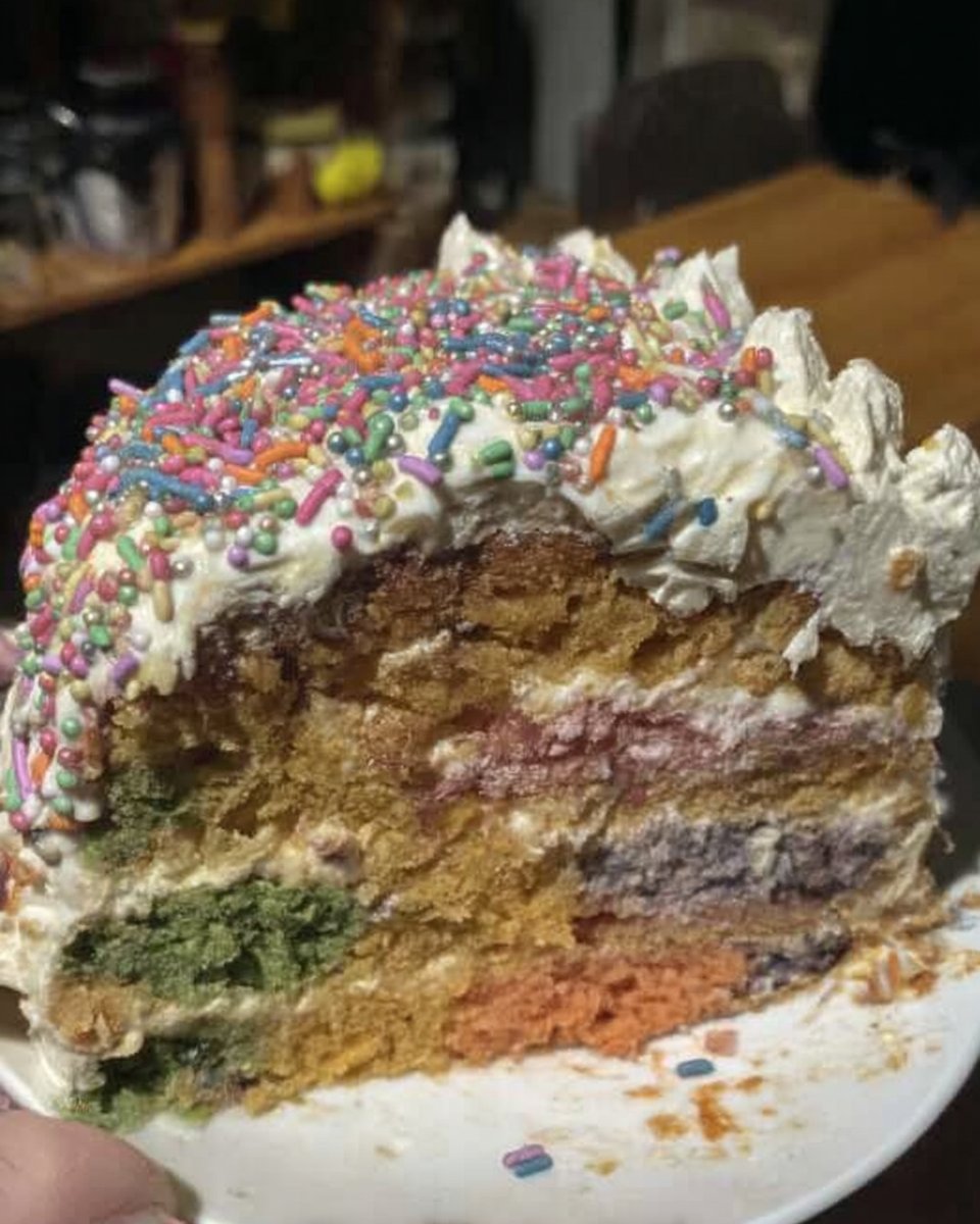 Ingredients for pinata cake including flour butter eggs and gel food coloring