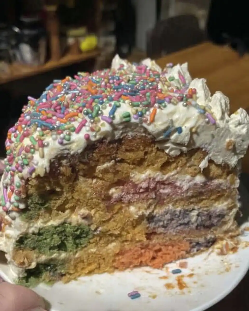 Ingredients for pinata cake including flour butter eggs and gel food coloring