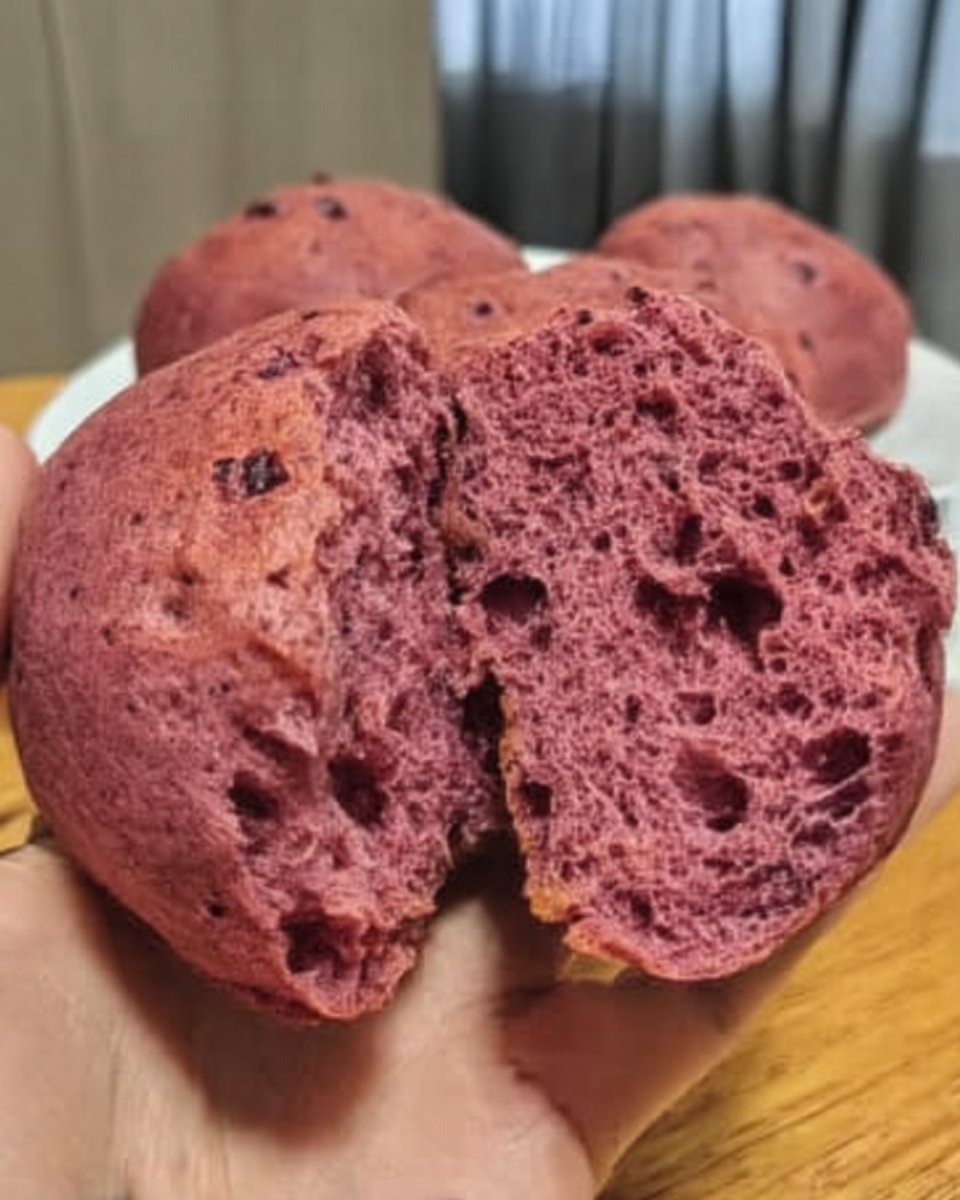 Purple cake batter being mixed in a bowl