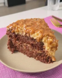 A slice of rustic German chocolate cake on a plate