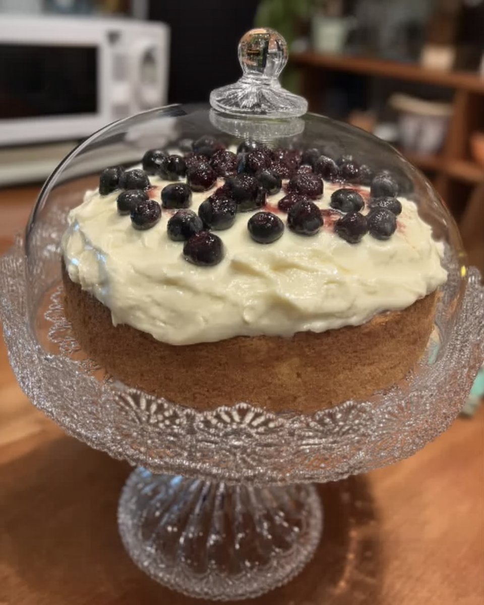 Lemon blueberry cake slice served with a fork