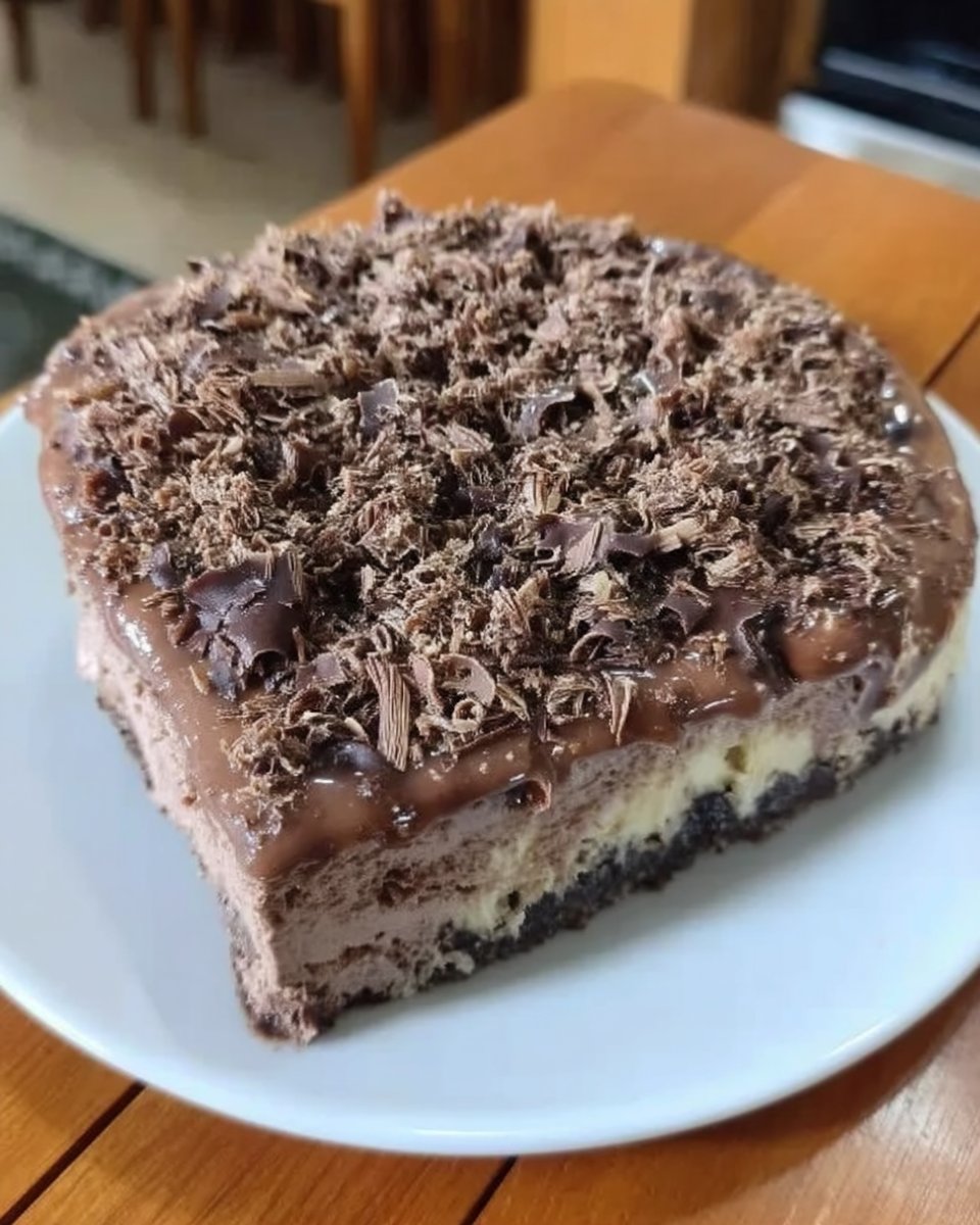 Chocolate Cheesecake 14 Whole chocolate cheesecake with ganache being poured over it