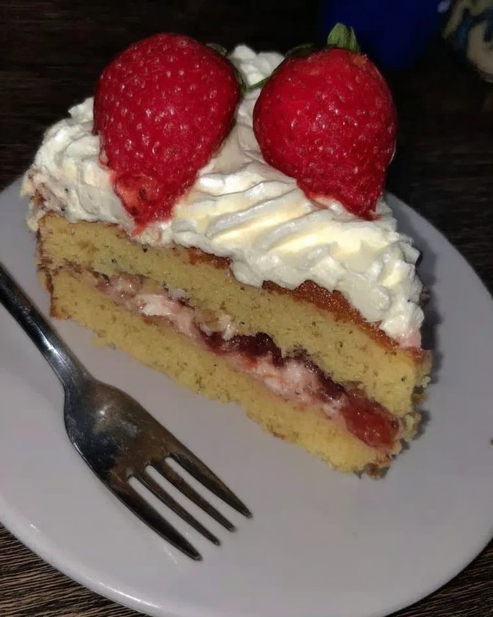 Ingredients for vanilla cake including cake flour butter and eggs on a wooden table