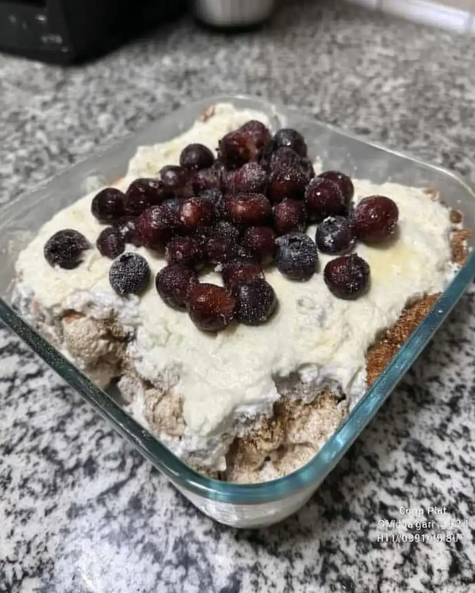 Whole strawberry icebox cake garnished with toffee bits ready to serve