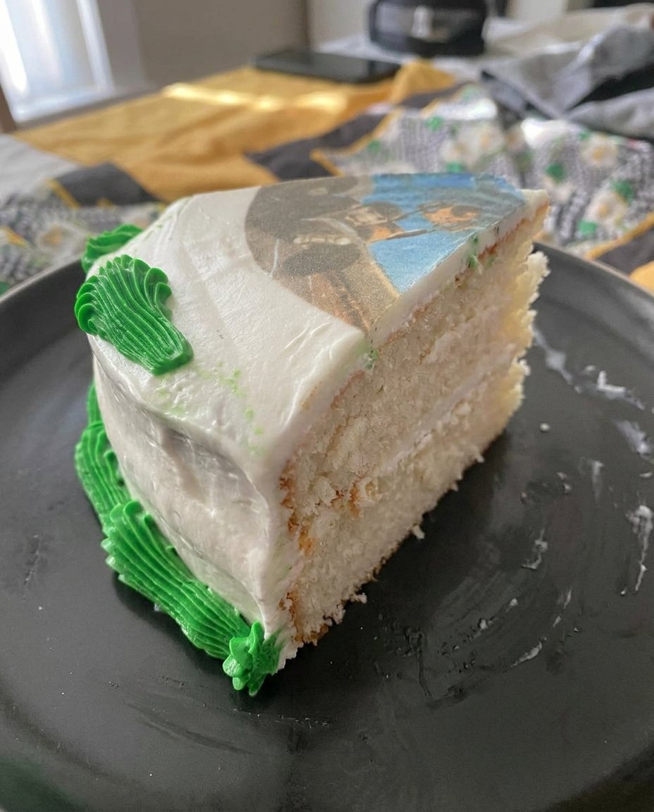 Photo Cake 12 Fresh ingredients including cream cheese, eggs, and graham crackers laid out on a wooden table.