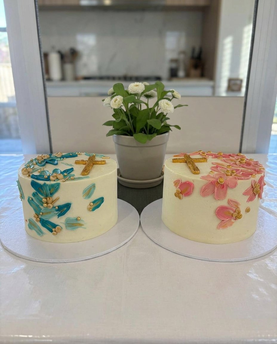 A tall white baptism cake with intricate star piped buttercream frosting and floral decorations