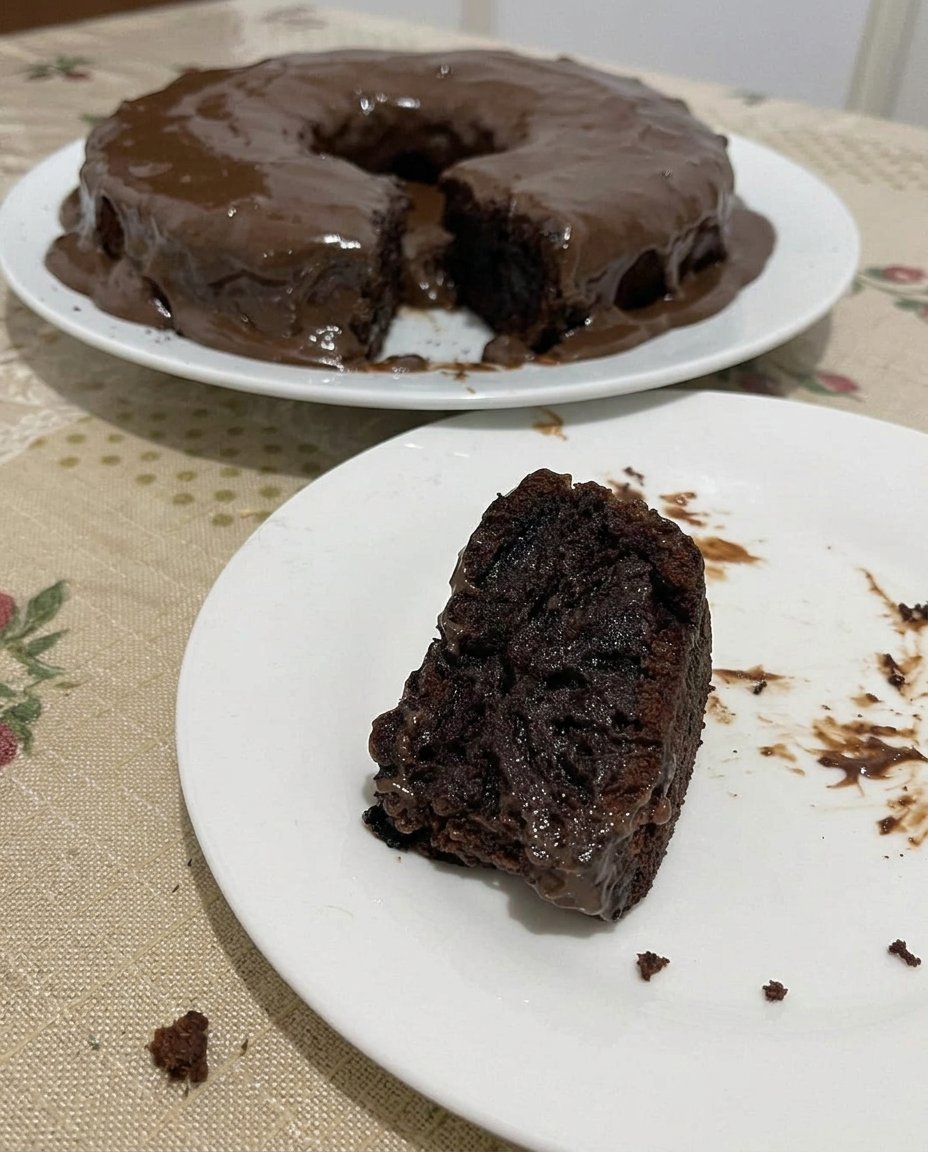 Boiling water being poured into cocoa powder and flour mixture
