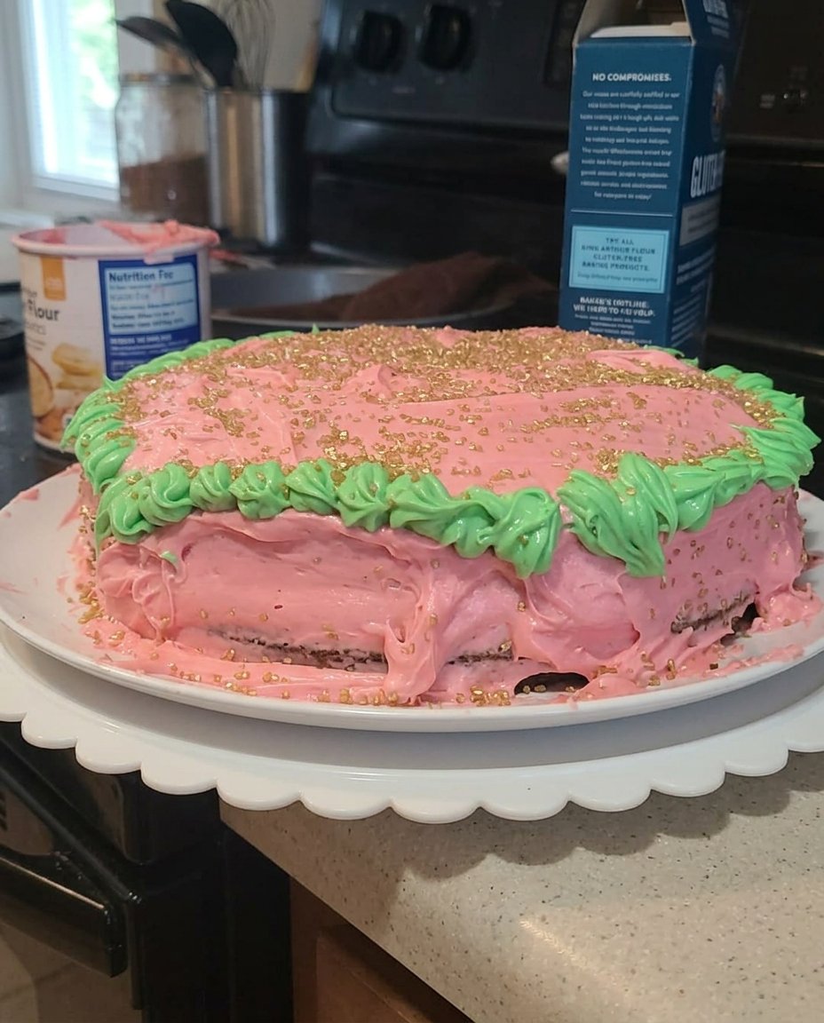 An instant-read thermometer checking the temperature of a Christmas cake