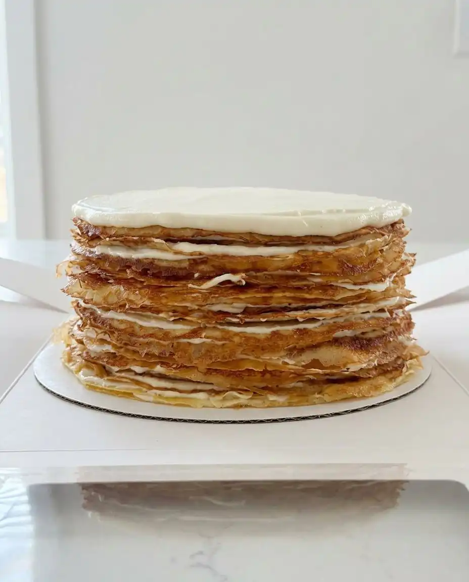 Crepe Cake 10 A professional cross section of a chocolate crepe cake showing twenty even layers