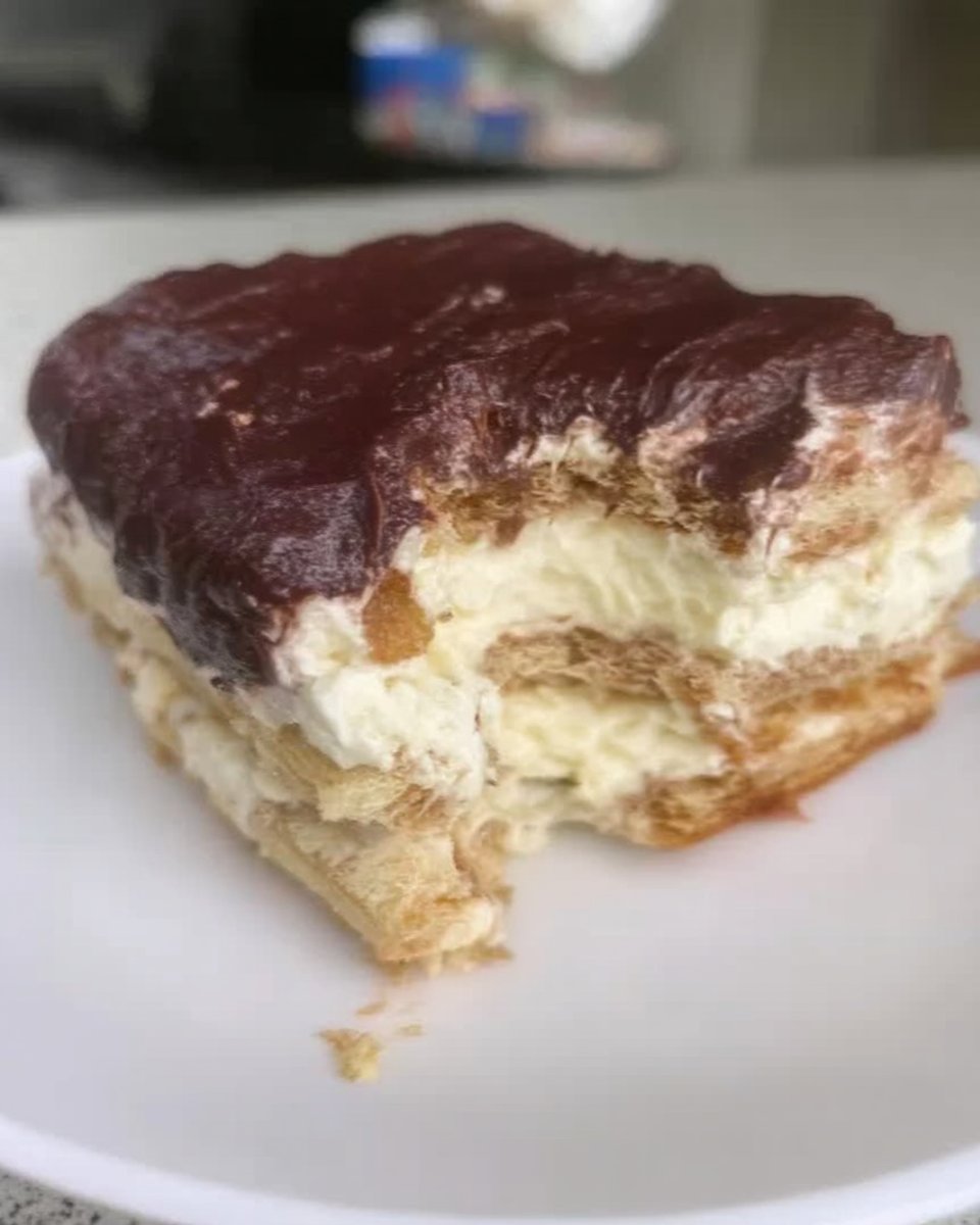 Ingredients for chocolate eclair cake including pudding mix milk and whipped topping