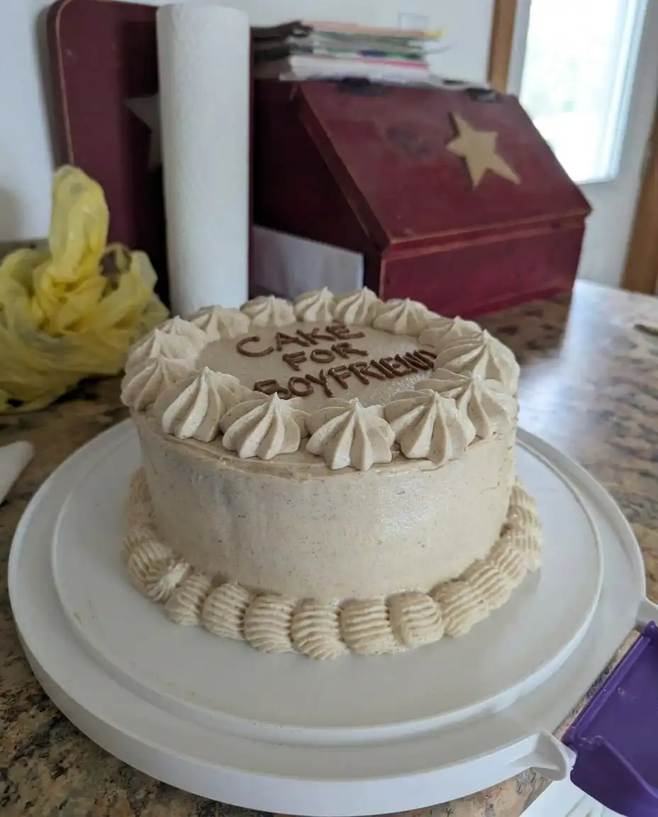 A slice of chocolate cake for boyfriend on a rustic wooden serving board