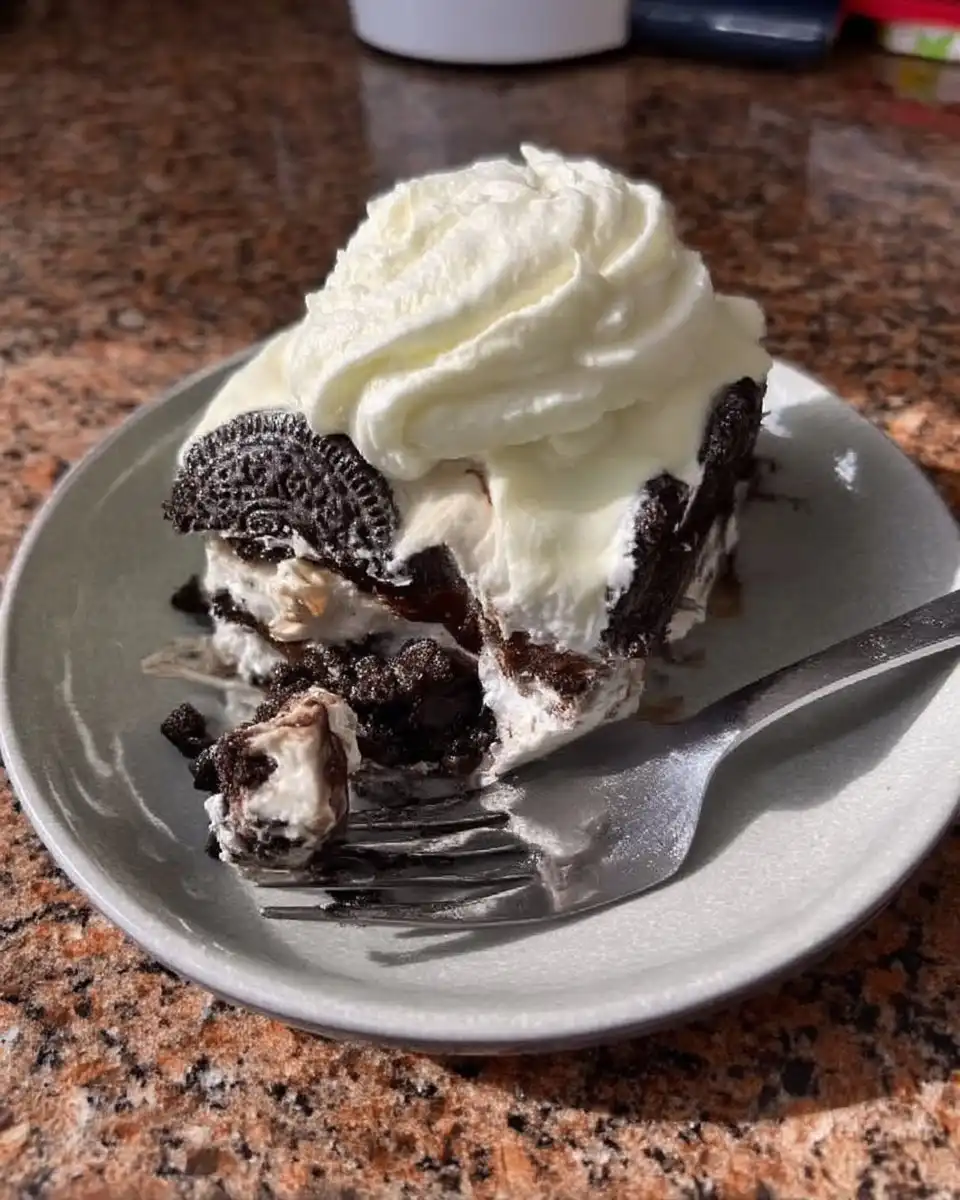 Fresh heavy cream powdered sugar and Oreo cookies on a counter