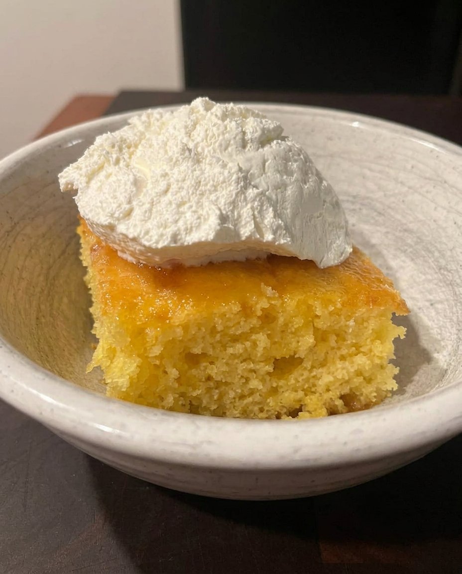 Fresh lemons, eggs, and bowls of sugar and zest on a flour-dusted counter.