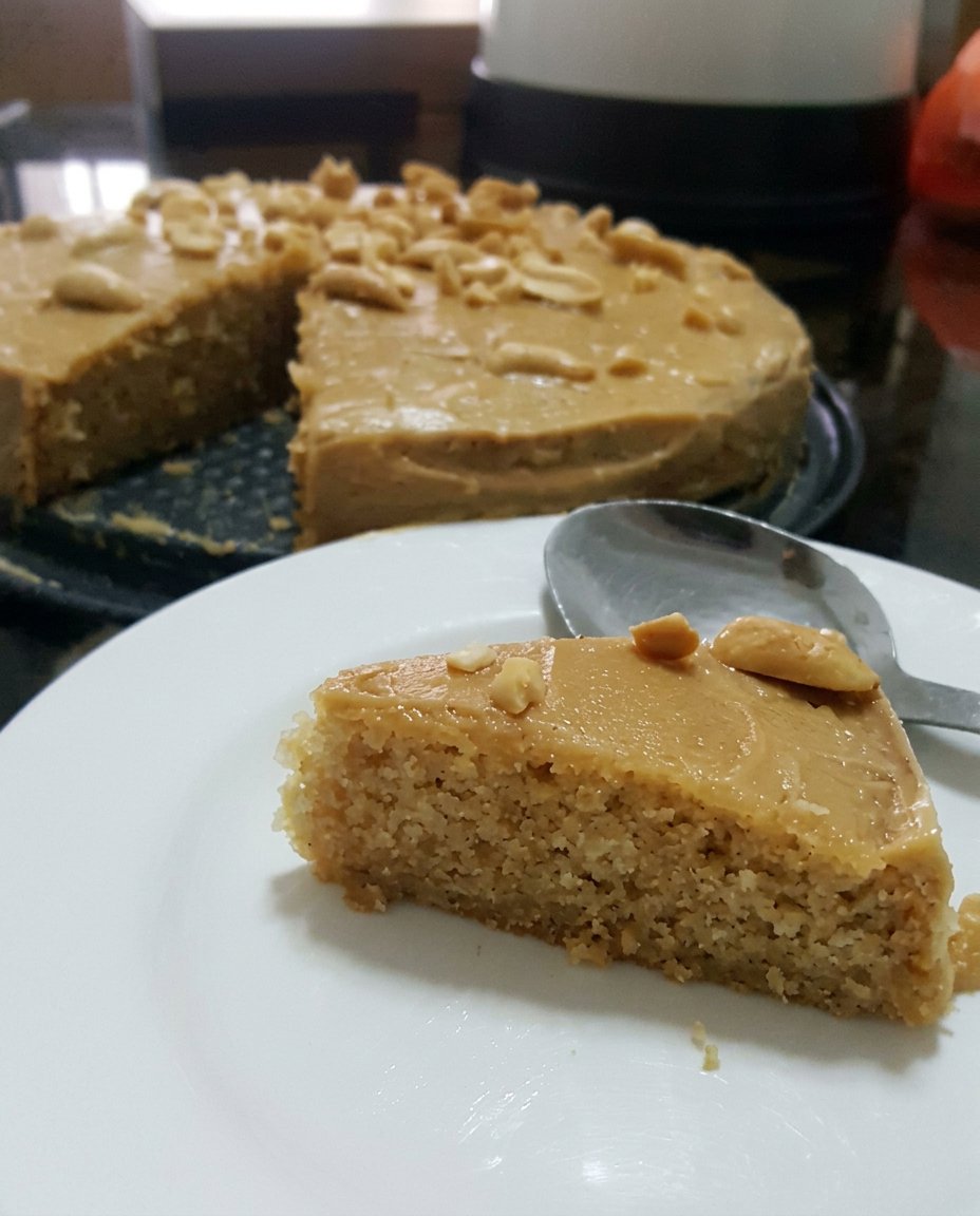 Cake Mix Recipes 14 A beautifully frosted two-layer cake sitting on a decorative glass cake stand.