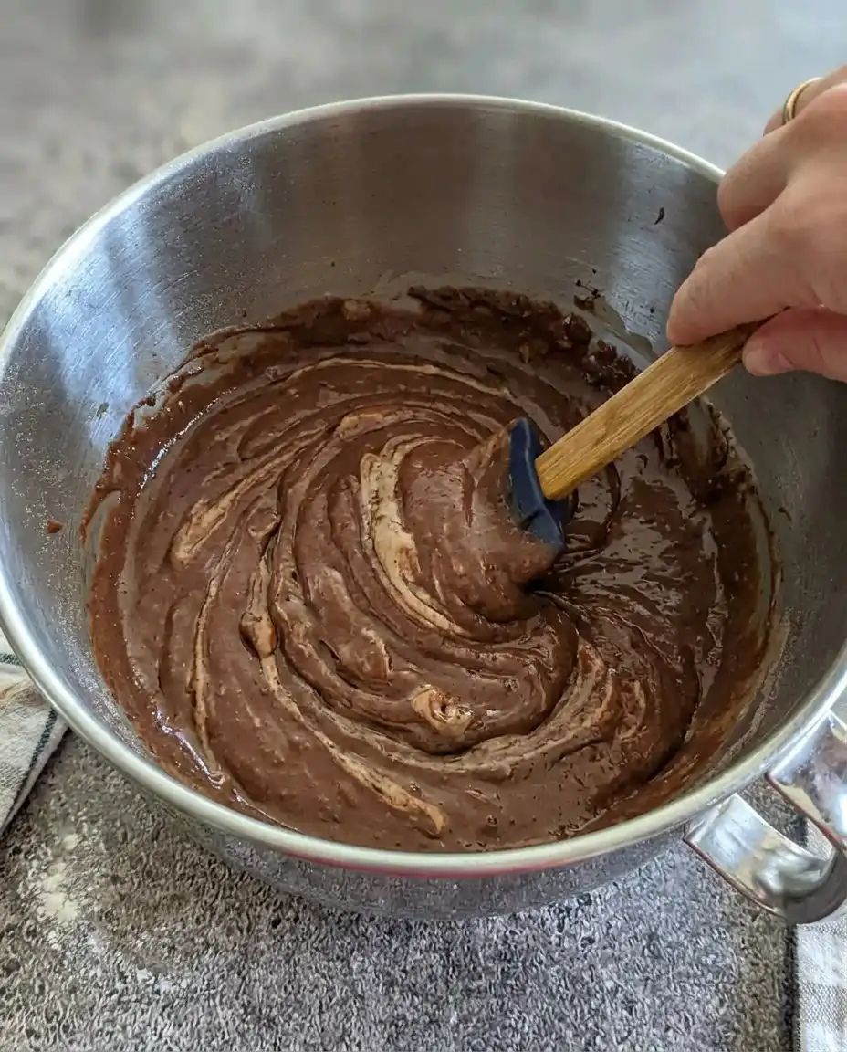 Layout of ingredients for the black forest pastry cake including cocoa and cherries.