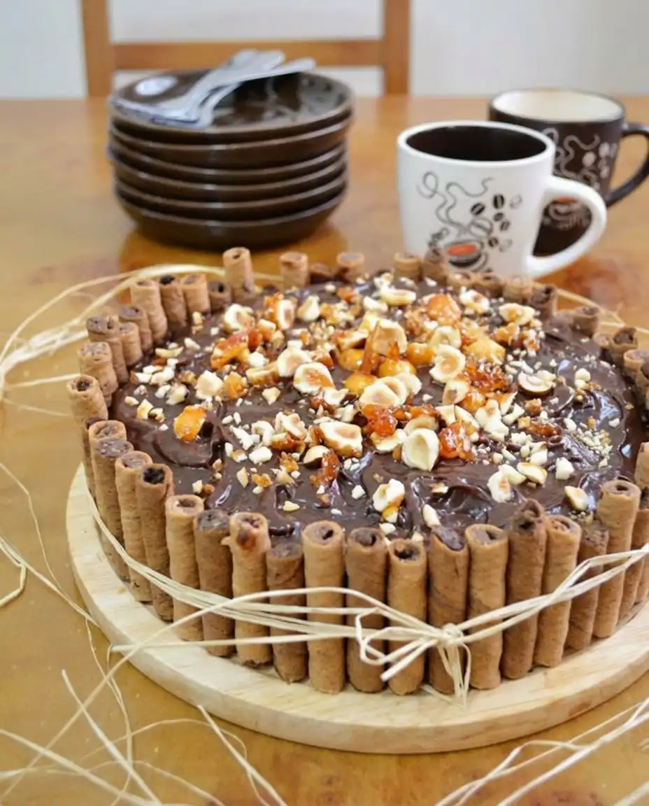 Glossy chocolate ganache being poured over a dark chocolate cake
