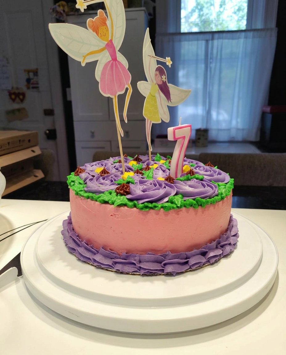A slice of strawberry girl cake on a rustic ceramic plate