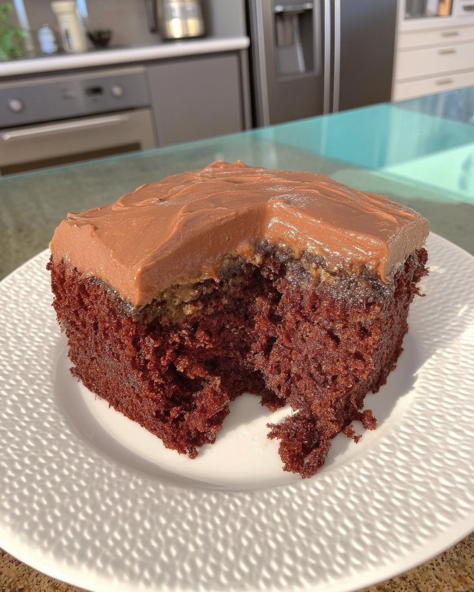 Simple Cake 14 A slice of simple cake topped with a dollop of whipped cream and fresh red berries.