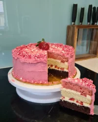 A rustic strawberry cake on a wooden table reflecting Southern charm