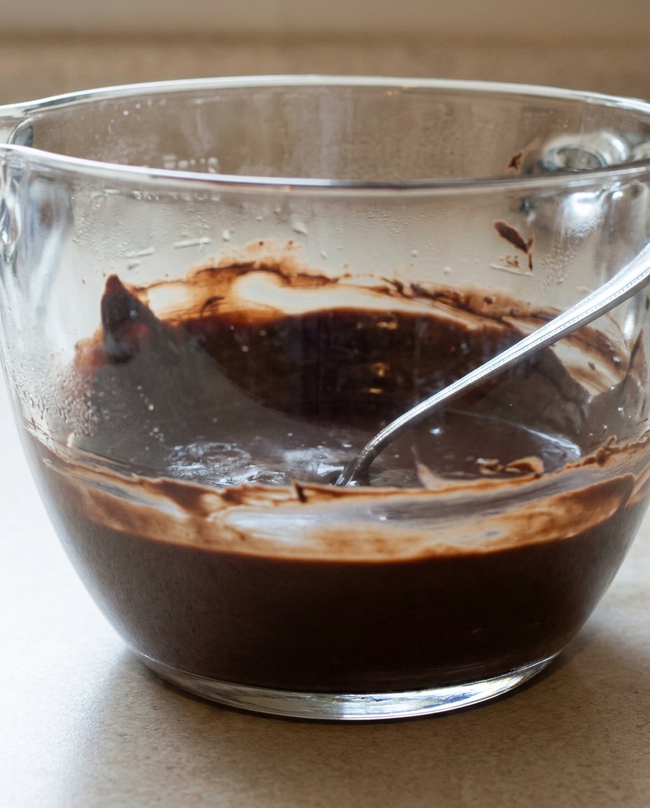 Chocolate Ganache Cake 12 Ingredients for chocolate cake measured out in glass bowls