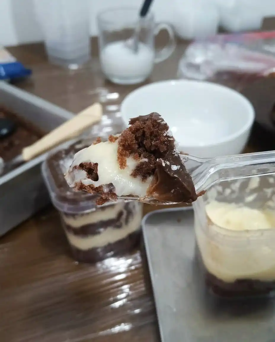 Using a circle cutter to make cake rounds for assembly in jars