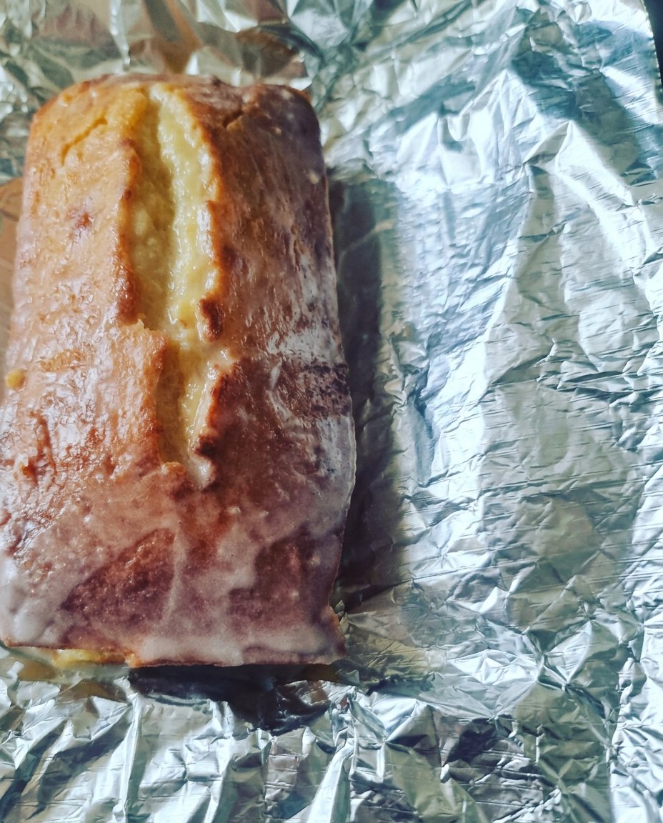 Lemon Drizzle Cake 3 12 Fresh lemons, bowls of flour and sugar, and farm-fresh eggs arranged on a marble countertop.