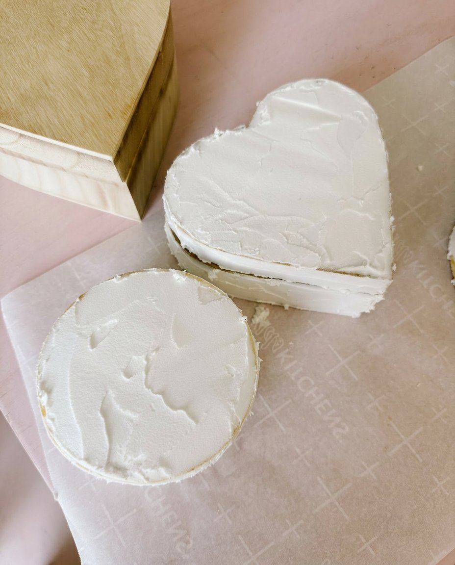 Hershey strawberry cream chocolate dripping down the side of a chilled cake