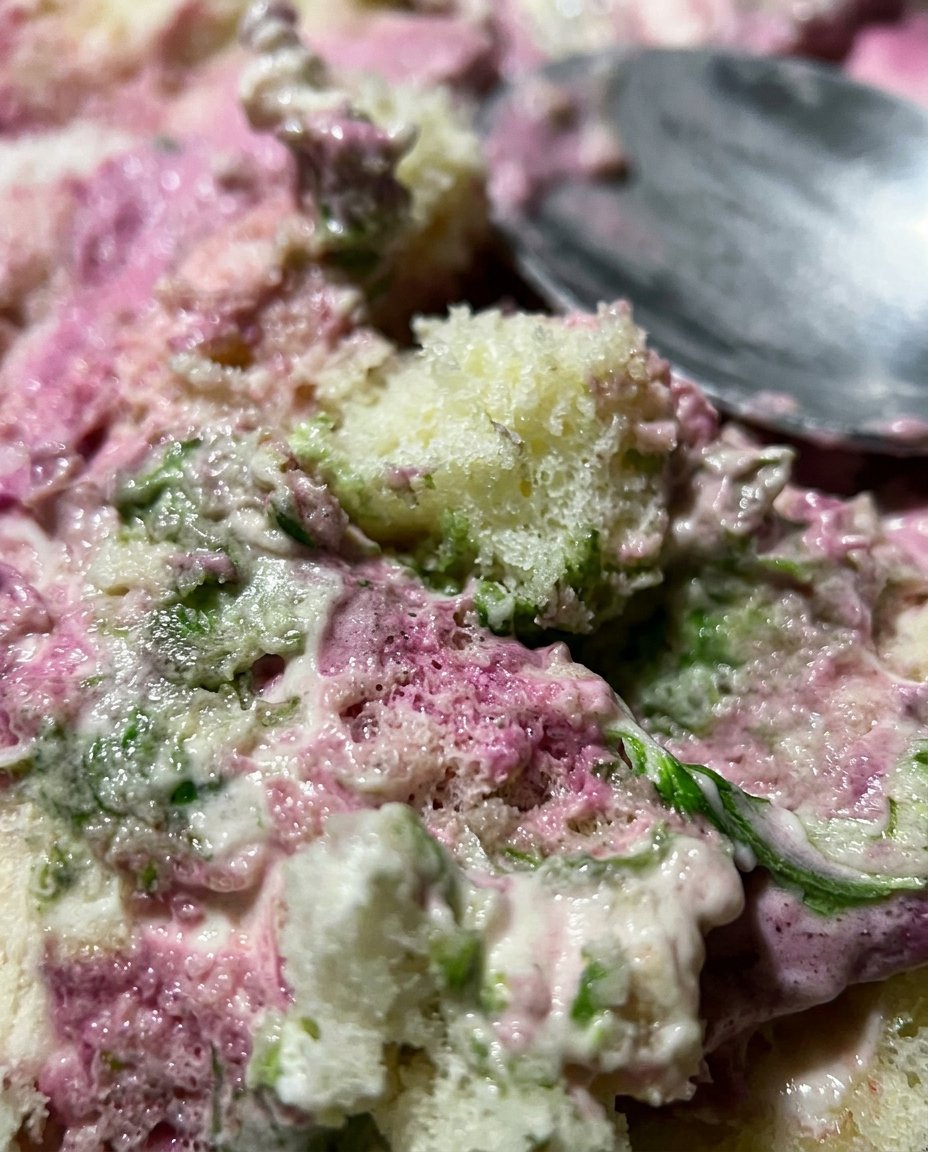 Tulip Cake 13 Close up of a hand piping a buttercream tulip petal on a flower nail