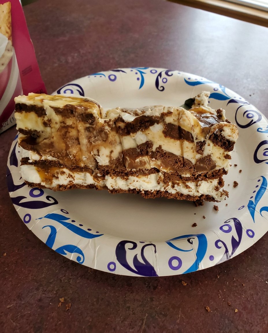 A collection of high quality ice cream quarts and ice cream sandwiches on a marble counter