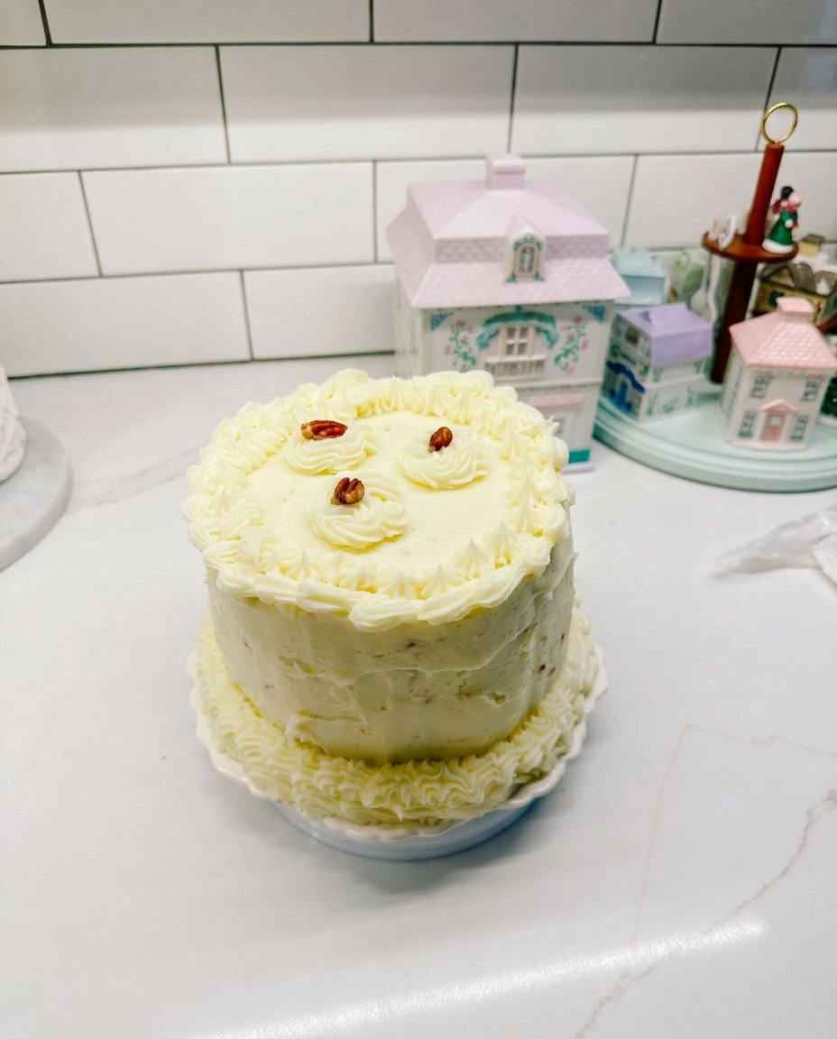 A beautifully sliced fake cake showing even layers of sponge and frosting