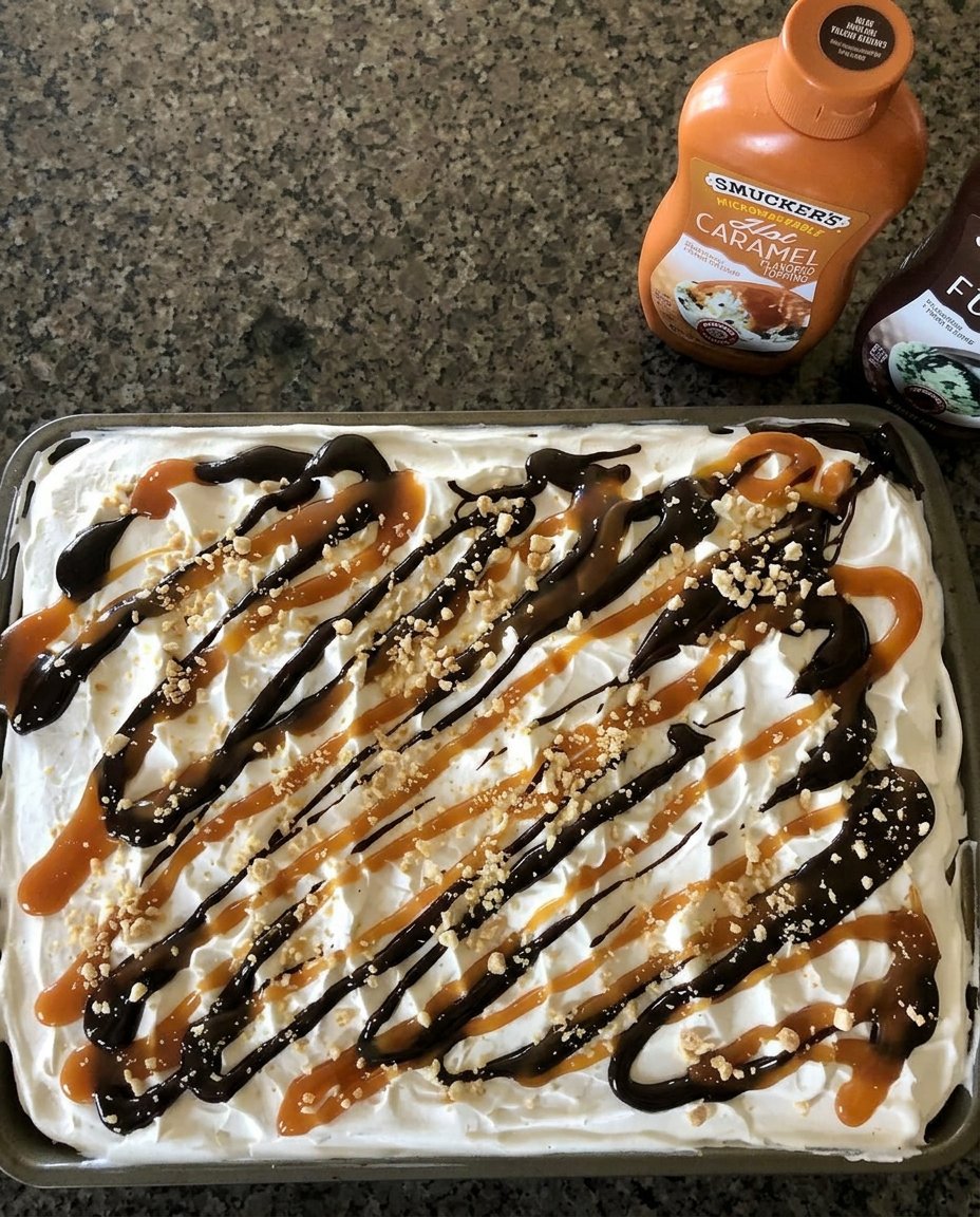 A person using a warm knife to slice through a frozen ice cream cake