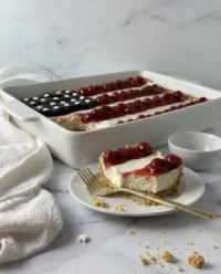 A clean slice of American flag no bake cheesecake showing sharp layers