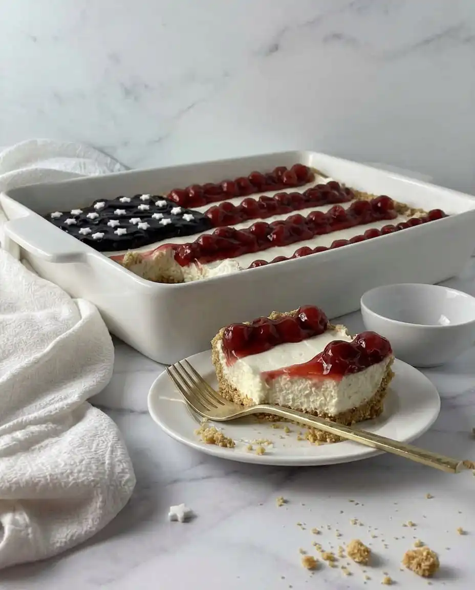 American Flag Cake No-Bake Cheesecake 10 A clean slice of American flag no bake cheesecake showing sharp layers