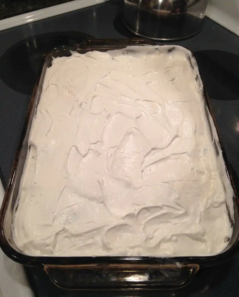Chocolate Delight 13 A golden brown pecan crust cooling in a glass baking dish.
