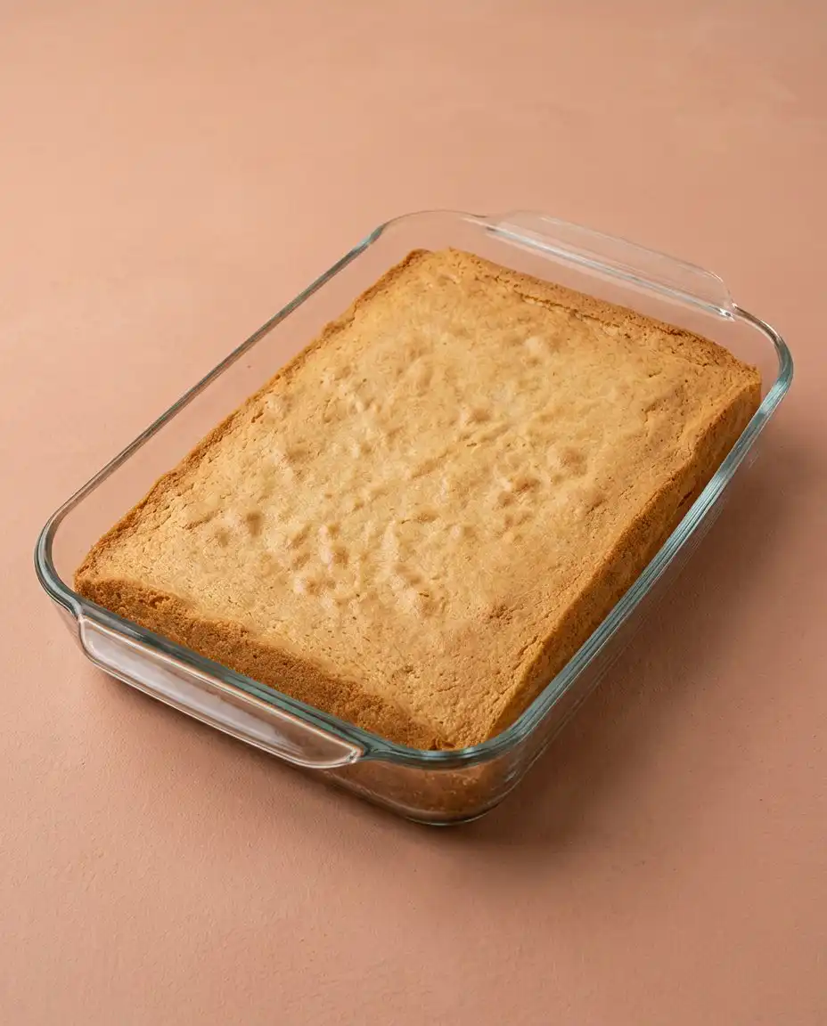 Unsalted butter softening on a linen tea towel for the Best Strawberry Sheet Cake.